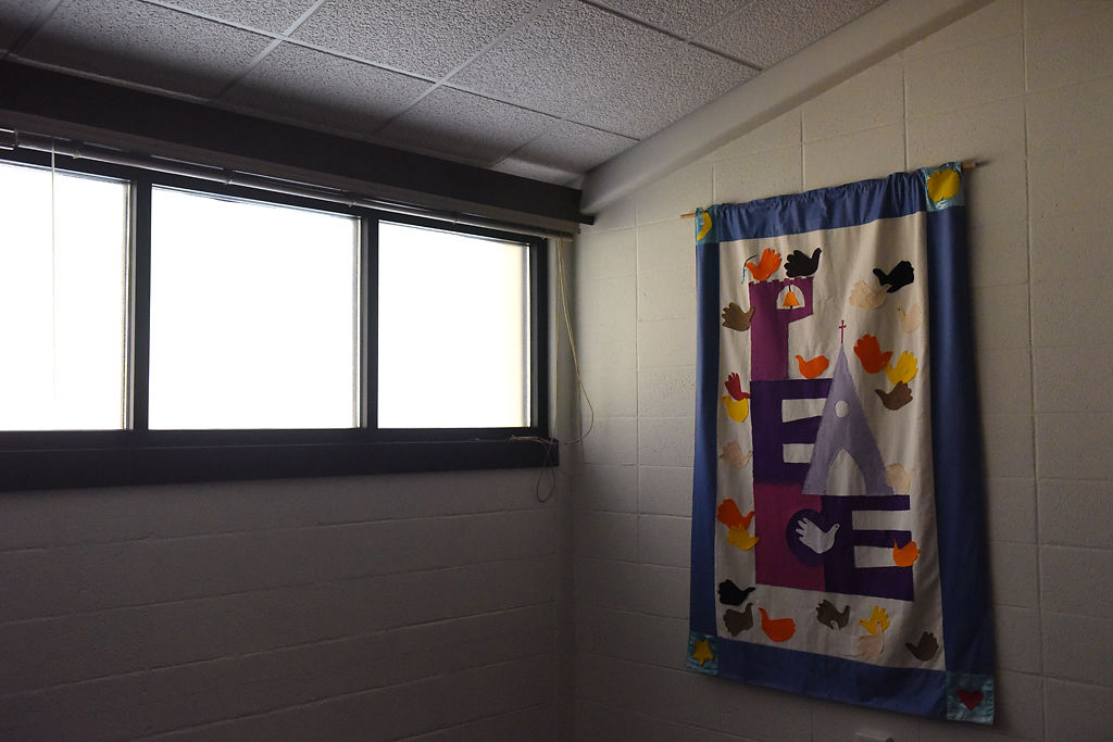 A banner hangs in a room during the memorial service and reception